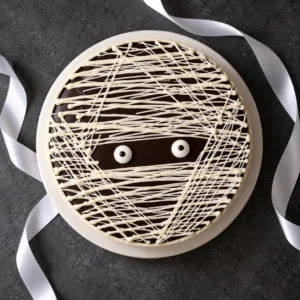 Halloween Sinful Chocolate Zombie Cake with white chocolate strands and two candy eyes